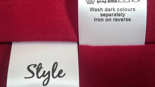 A sample of fabric clothing care labels